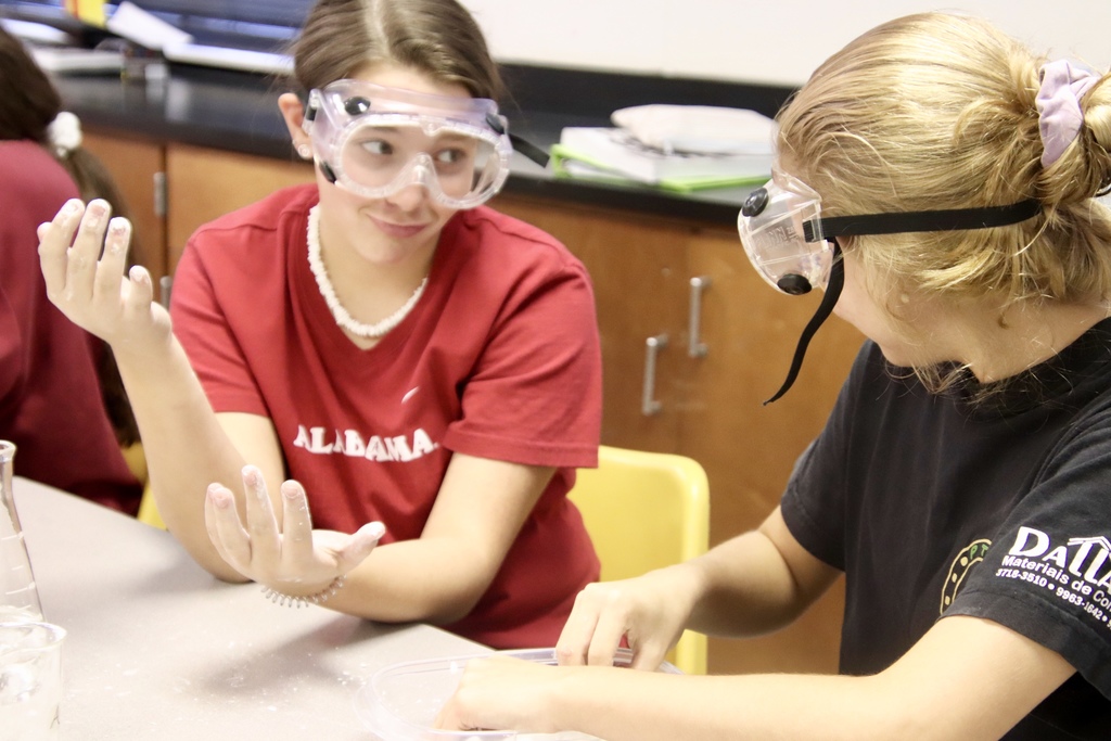 8th grade physical science student action shots during a lab