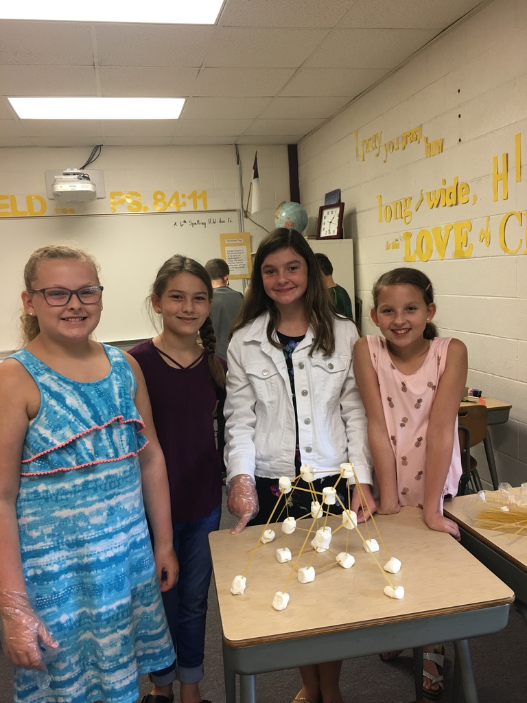 Girls finishing 6th grade science experiment